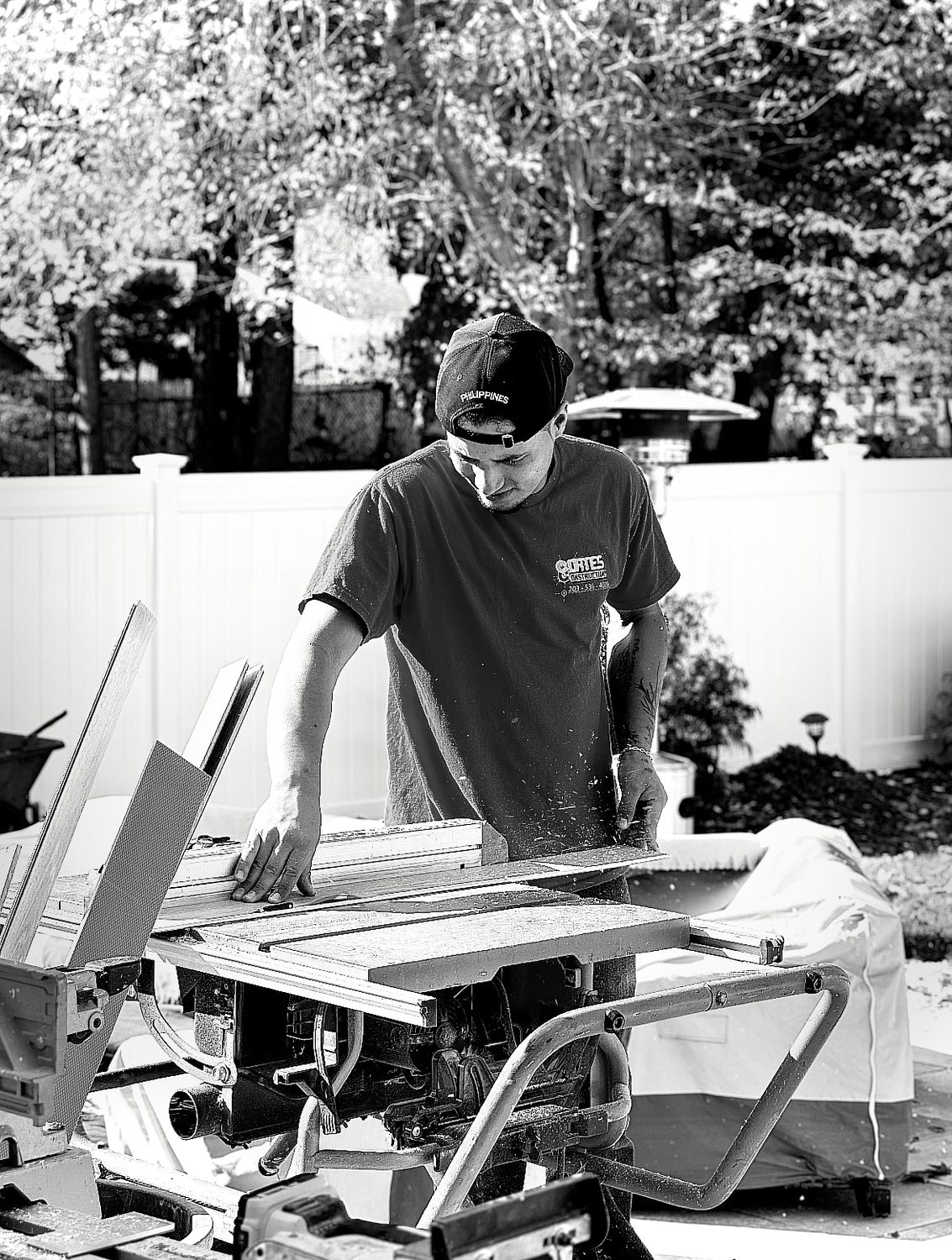 A builder at work on a More Life home, black and white.