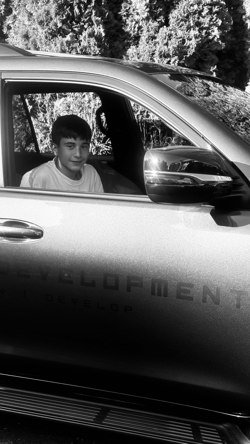 A builder at work on a More Life home, black and white.
